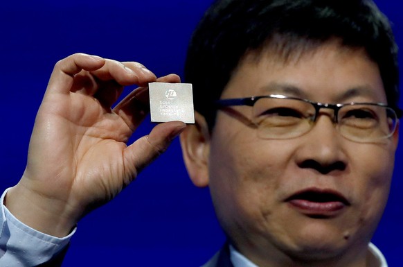 epa06564642 Huawei&#039;s CEO, Richard Yu, presents the new 5G chip Balong 5G01 on the sidelines of the Mobile World Congress (MWC) in Barcelona, Spain, 25 February 2018. The MWC will be held from 26  ...