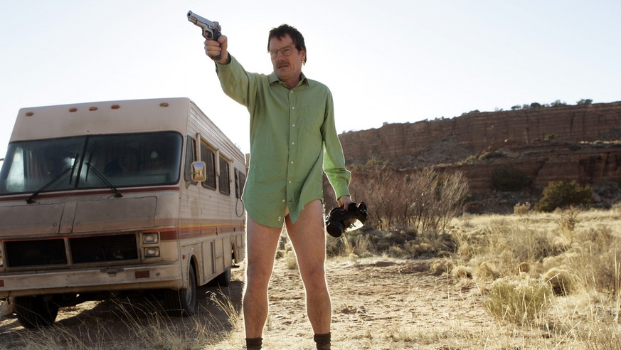 This image released by AMC shows Walter White, played by Bryan Cranston, next to the Winnebago he uses as a mobile meth lab in the pilot episode of &quot;Breaking Bad.&quot; The series finale of the p ...