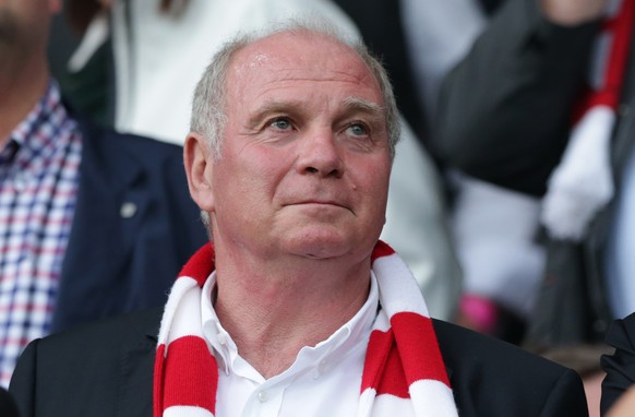 FILE - In this Aug. 27, 2013 file photo Bayern Munich president Uli Hoeness watches the German first division Bundesliga soccer match between SC Freiburg and FC Bayern Munich, in Freiburg, southern Ge ...