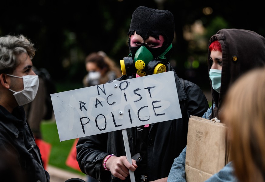 epa08459801 Protesters gather during a Black Lives Matter protest following the deadly arrest of George Floyd in Minneapolis, in Sydney, Australia, 02 June 2020. A bystander&#039;s video posted online ...
