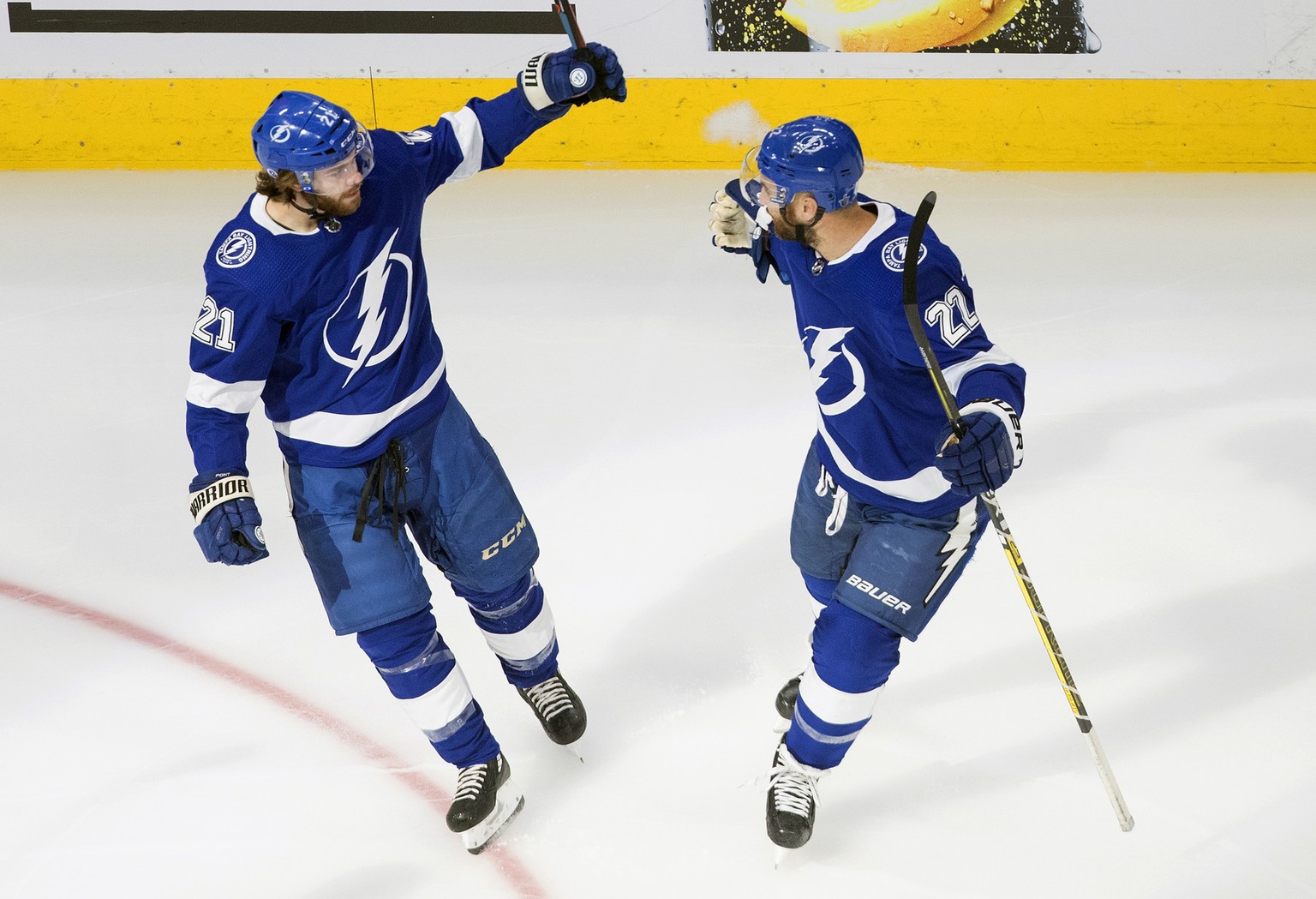 Tampa Bay Lightning&#039;s Brayden Point (21) and Kevin Shattenkirk (22) celebrate a goal against the New York Islanders during the first period of an NHL Eastern Conference final playoff game, Monday ...