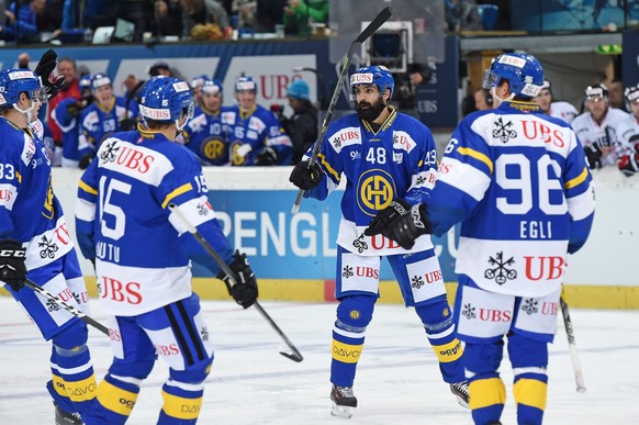 Davos Daniel Rahimi (48) celebrates after scoring 2-2 with the team during the game between Switzerlands HC Davos and Team Canada at the 90th Spengler Cup ice hockey tournament in Davos, Switzerland,  ...