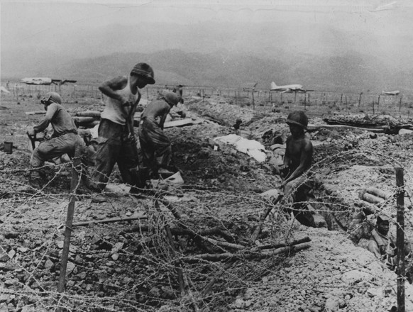 French Legion and Algerian soldiers work to rebuild their camp fortifications after intense fighting with Communist Viet Minh forces at Dien Bien Phu, Indochina, March 15, 1954. The allied forces and  ...