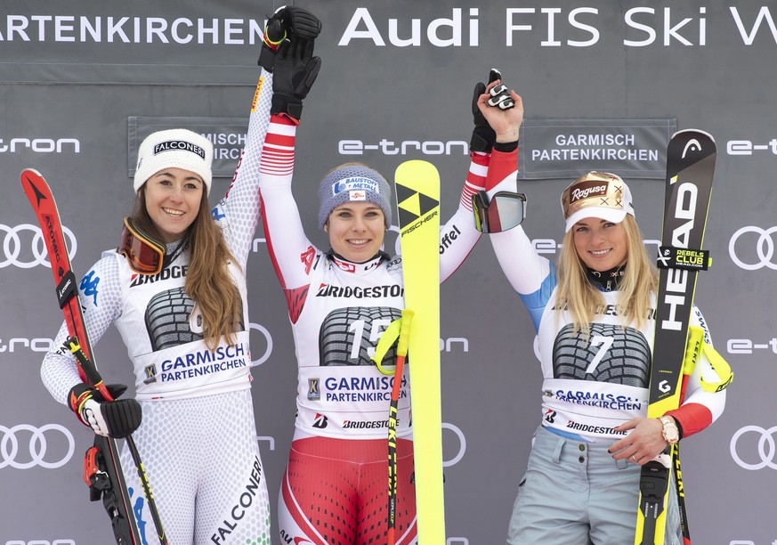 epa07321602 (L-R) second placed Sofia Goggia of Italy, winner Nicole Schmidhofer of Austria and third placed Lara Gut-Behrami of Switzerland celebrate on the podium for the women&#039;s Super-G race a ...