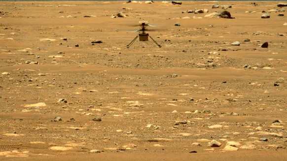 epa09152831 A handout photo made available by the NASA shows the Ingenuity helicopter during rotorcraft&#039;s second experimental test flight, captured by the NASA&#039;s Mars Perseverance rover&#039 ...