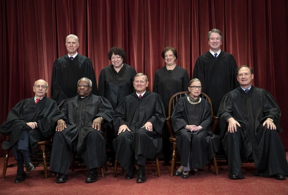 FILE - In this Nov. 30, 2018, file photo, the justices of the U.S. Supreme Court gather for a formal group portrait to include the new Associate Justice, top row, far right, at the Supreme Court Build ...