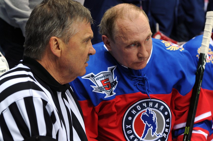 epa05298309 International Ice Hockey Federation (IIHF) President Rene Fasel (L) and Russian President Vladimir Putin (R) speak during a gala match of the Night Hockey League at the Bolshoi Ice Arena i ...