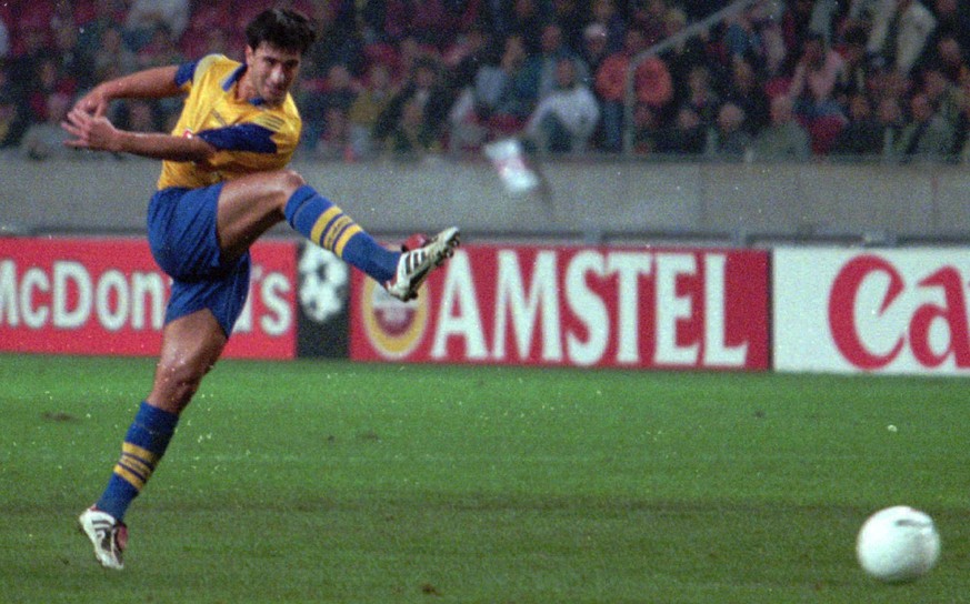 Grasshoppers Murat Yakin scores decisive goal against Ajax during a Champions League match in Amsterdam, Wednesday Sept. 25 1996. Grasshoppers won 1-0.(AP Photo/Dusan Vranic)