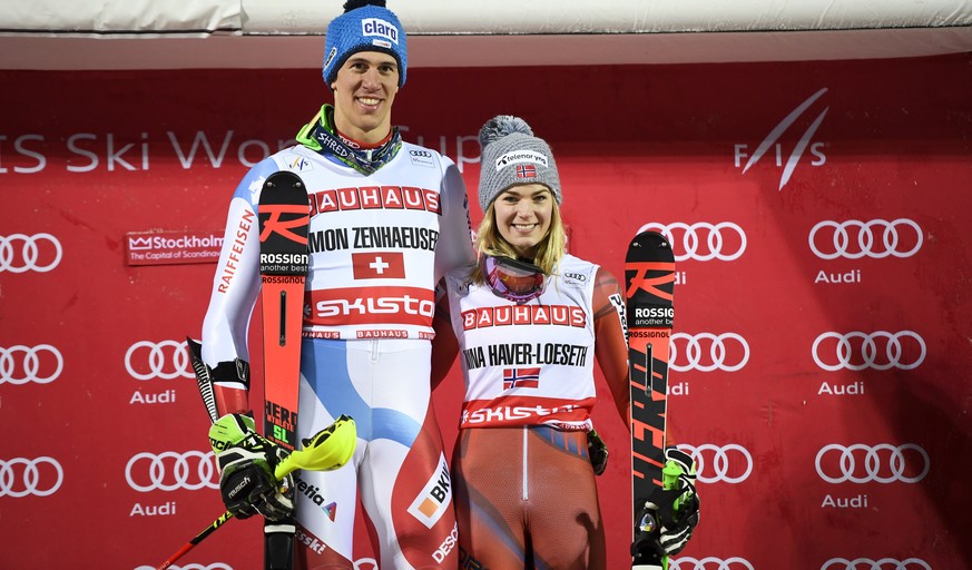 Winners Ramon Zenhausern, left, of Switzerland and Norway&#039;s Nina Haver Loeseth pose on the podium after winning their division of the FIS Ski World Cup parallel slalom city event in Hammarbybacke ...