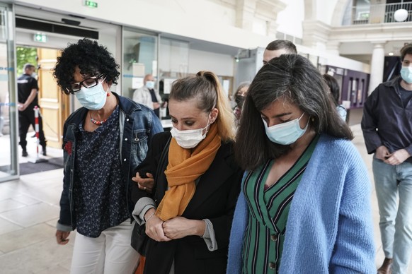 Valerie Bacot, center, arrives with relatives at the Chalon-sur-Saone courthouse, central France, Thursday, June 24, 2021. Valerie Bacot is on trial in France for killing her husband after decades of  ...