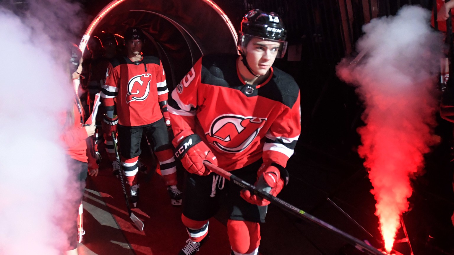 New Jersey Devils center Nico Hischier comes onto the ice before an NHL hockey game against the Colorado Avalanche Saturday, Oct. 7, 2017, in Newark, N.J. (AP Photo/Bill Kostroun)