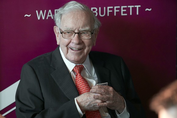 FILE - In this May 5, 2019, file photo Warren Buffett, Chairman and CEO of Berkshire Hathaway, smiles as he plays bridge following the annual Berkshire Hathaway shareholders meeting in Omaha, Neb. Buf ...