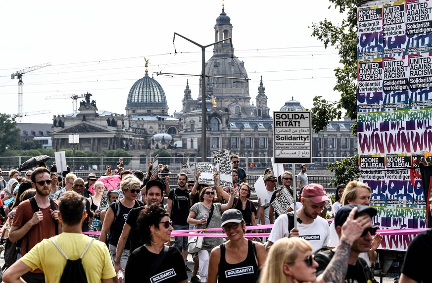 epa07790393 People attend a mass rally for an open society organized by action group &#039;Unteilbar&#039; (indivisible) in Dresden, Germany, 24 August 2019. The rally calls for tolerance and diversit ...