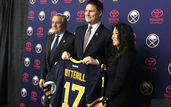 Newly hired Buffalo Sabres&#039; General Manager Jason Botterill, center, displays his Sabres jersey at First Niagara Center in Buffalo, N.Y., Thursday, May 11, 2017. Botterill is leaving the Pittsbur ...