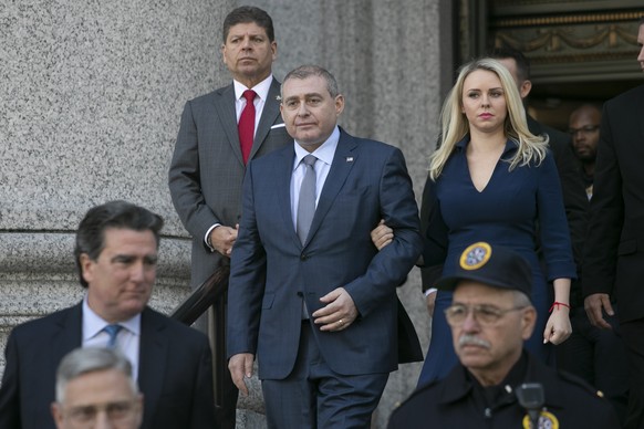 Lev Parnas, center, leaves federal court following his arraignment, Wednesday, Oct. 23, 2019 in New York. Parnas and Igor Fruman are charged with conspiracy to make illegal contributions to political  ...