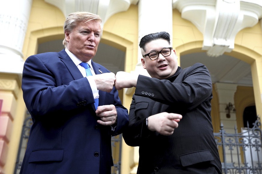 U.S. President Donald Trump impersonator Russell White, left, and Kim Jong-un impersonator Howard X pose for photos outside the Opera House in Hanoi, Vietnam, Friday, Feb. 22, 2019. The second summit  ...