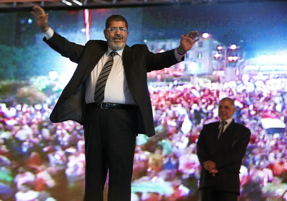 FILE - In this May 20, 2012 file photo, then Muslim Brotherhood&#039;s presidential candidate Mohammed Morsi holds a rally in Cairo, Egypt. On Monday June 17, 2019, Egypt&#039;s state TV says the coun ...