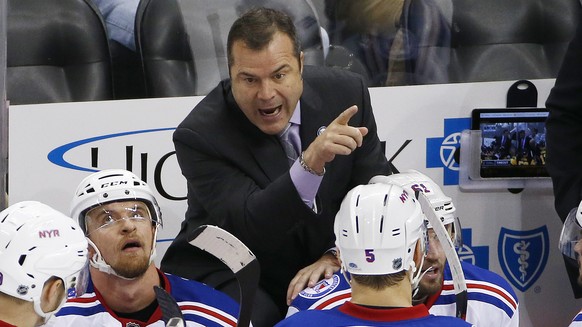 New York Rangers head coach Alain Vigneault , top, gives instructions in the third period of an NHL hockey game against the Pittsburgh Penguins in Pittsburgh, Monday, Nov. 21, 2016. (AP Photo/Gene J.  ...