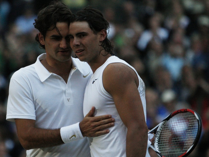 Roger Federer congratulates Spain&#039;s Rafael Nadal after he won the the Men&#039;s Singles final on the Centre Court at Wimbledon, Sunday, July 6, 2008. (AP Photo/Alessia Pierdomenico, pool)