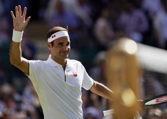 epa07695088 Roger Federer of Switzerland celebrates his win over Jay Clarke of Britain in their second round match during the Wimbledon Championships at the All England Lawn Tennis Club, in London, Br ...