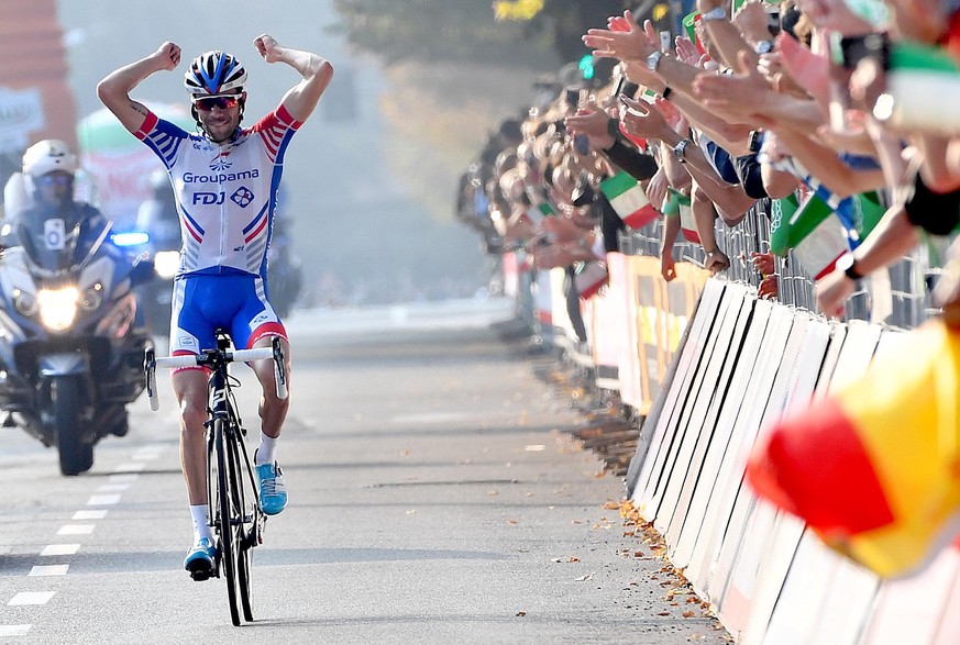 First placed, France&#039;s Thibaut Pinot celebrates as he crosses the finish line of the Giro di Lombardia cycling race in Como, Italy, Saturday, Oct. 13, 2018. (Daniel dal Zennaro/ANSA via AP)