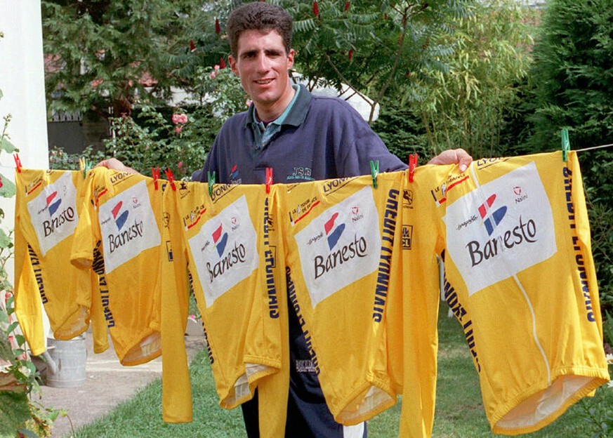 Spain (Espana): A file photo dated 22 July 1996 of Spanish five-time winner of Tour de France cyclist Miguel Indurain posing after his fifth Tour de France win with five yellow jerseys he won from 199 ...