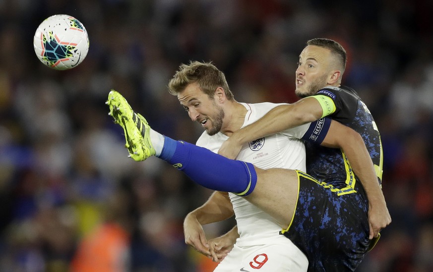 England&#039;s Harry Kane, left, and Kosovo&#039;s Amir Rrahmani challenge for the ball during the Euro 2020 group A qualifying soccer match between England and Kosovo at St Mary&#039;s Stadium in Sou ...