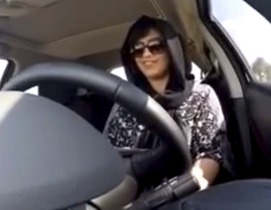 FILE - This Nov. 30, 2014 image made from video released by Loujain al-Hathloul, shows her driving towards the United Arab Emirates - Saudi Arabia border before her arrest on Dec. 1, 2014, in Saudi Ar ...