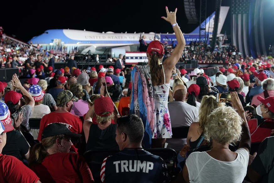 Supporters listen as President Donald Trump speaks during a campaign rally at Orlando Sanford International Airport, Monday, Oct. 12, 2020, in Sanford, Fla. (AP Photo/Evan Vucci)
Donald Trump