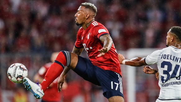 epa06969793 Bayern&#039;s Jerome Boateng (L) in action with Hoffenheim&#039;s Joelinton during the German Bundesliga soccer match between Bayern Munich and 1899 Hoffenheim in Munich, Germany, 24 Augus ...