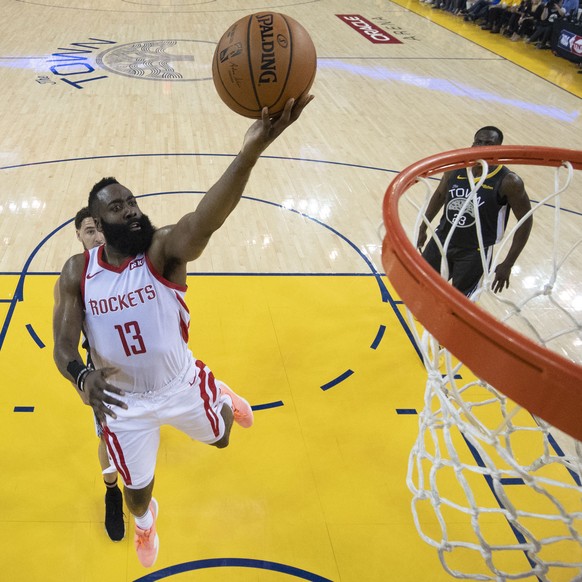 epa07539328 Houston Rockets guard James Harden shoots during the NBA Western Conference Playoff semifinal game two between the Golden State Warriors and the Houston Rockets at Oracle Arena in Oakland, ...
