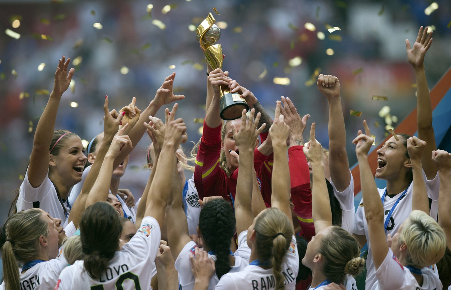 The United States Women&#039;s National Team celebrates with the trophy after they defeated Japan 5-2 in the FIFA Women&#039;s World Cup soccer championship in Vancouver, British Columbia, Canada, Sun ...