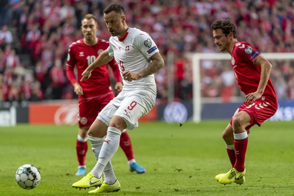 epa07915563 Switzerland&#039;s Haris Seferovic, left, fights for the ball against Denmark&#039;s Thomas Delaney, right, during the UEFA EURO 2020 qualifiers match between Denmark and Switzerland at th ...
