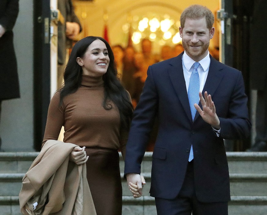 FILE - In this Tuesday, Jan. 7, 2020 file photo, Britain&#039;s Prince Harry and Meghan, Duchess of Sussex leave after visiting Canada House in London. The Duke and Duchess of Sussex say they will no  ...