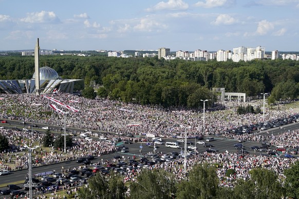 Belarusian opposition supporters rally in the center of Minsk, Belarus, Sunday, Aug. 16, 2020. Opposition supporters whose protests have convulsed the country for a week aim to hold a major march in t ...