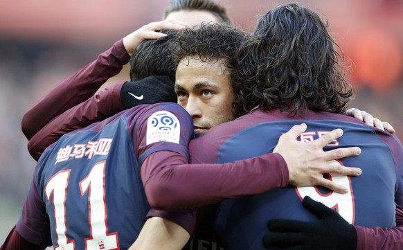 PSG&#039;s Neymar hugs teammates after Angel Di Maria scores a goal against Strasbourg during the French League One soccer match between Paris Saint Germain and Strasbourg, at the Parc des Princes sta ...