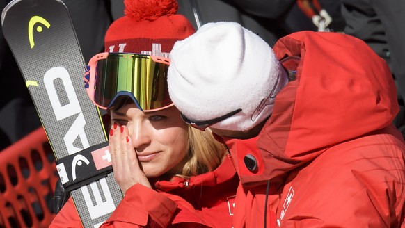 Lara Gut of Switzerland, left, reacts next to Pauli Gut, right, the father and the coach during the women Alpine Skiing Super G race in the Jeongseon Alpine Centre during the XXIII Winter Olympics 201 ...