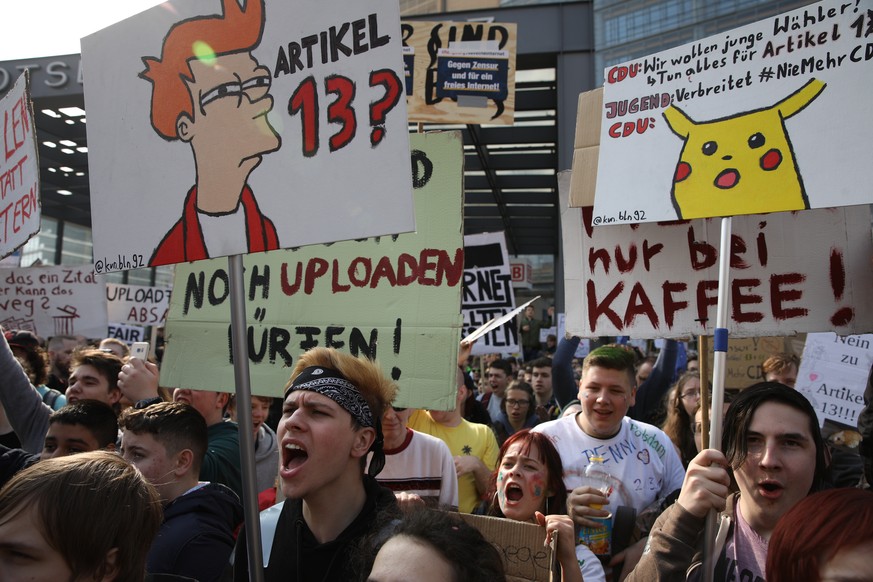 epa07458178 Protestors hold banners and chant slogans during the &#039;Save The Internet&#039; demonstration in Berlin, Germany, 23 March, 2019. The demonstrators are protesting against article 11 and ...