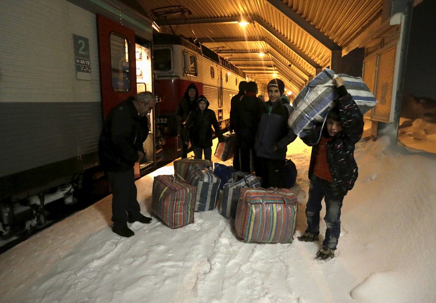 Flüchtlinge bei der Ankunft im nördlichsten Skiort der Welt, in Riksgransen, Schweden (15.12.2015).