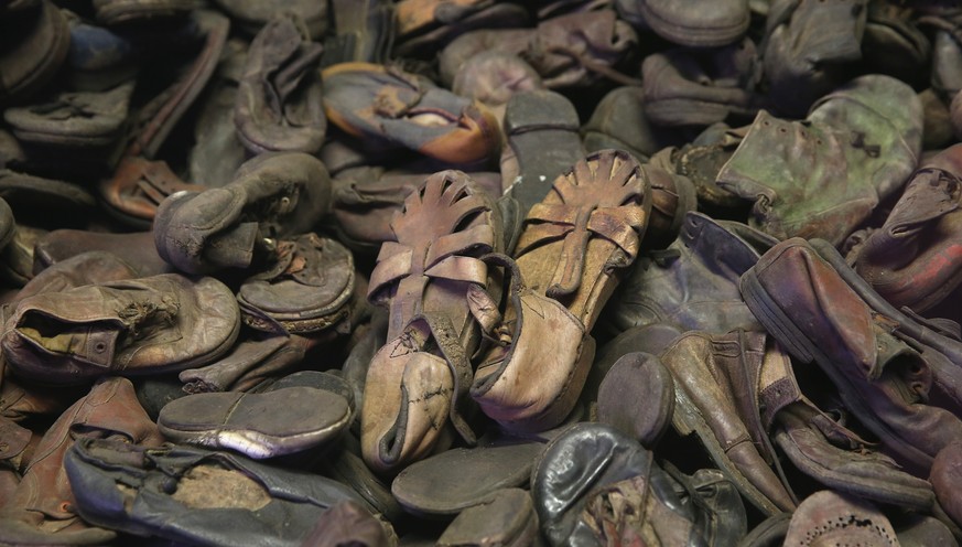 OSWIECIM, POLAND - JANUARY 25: Children&#039;s shoes confiscated from Auschwitz prisoners lie in an exhibtion display at the former Auschwitz I concentration camp, which today is a museum, on January  ...