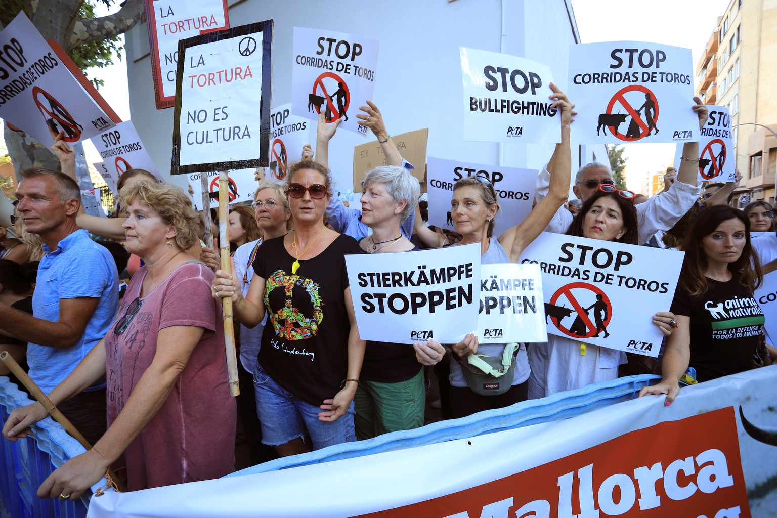 epa07764885 People attend a protest against bullfighting in Palma de Mallorca, Balearic Islands, Spain, 09 August 2019, on occasion of a bullfight held at the Coliseo Balear bullring. EPA/LLITERES