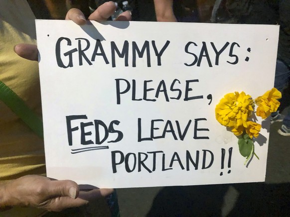 Mardy Widman, a 79-year-old grandmother of five, protests the presence of federal agents outside the Mark O. Hatfield Federal Courthouse in Portland, Ore., Monday, July 20, 2020. Widman said this was  ...