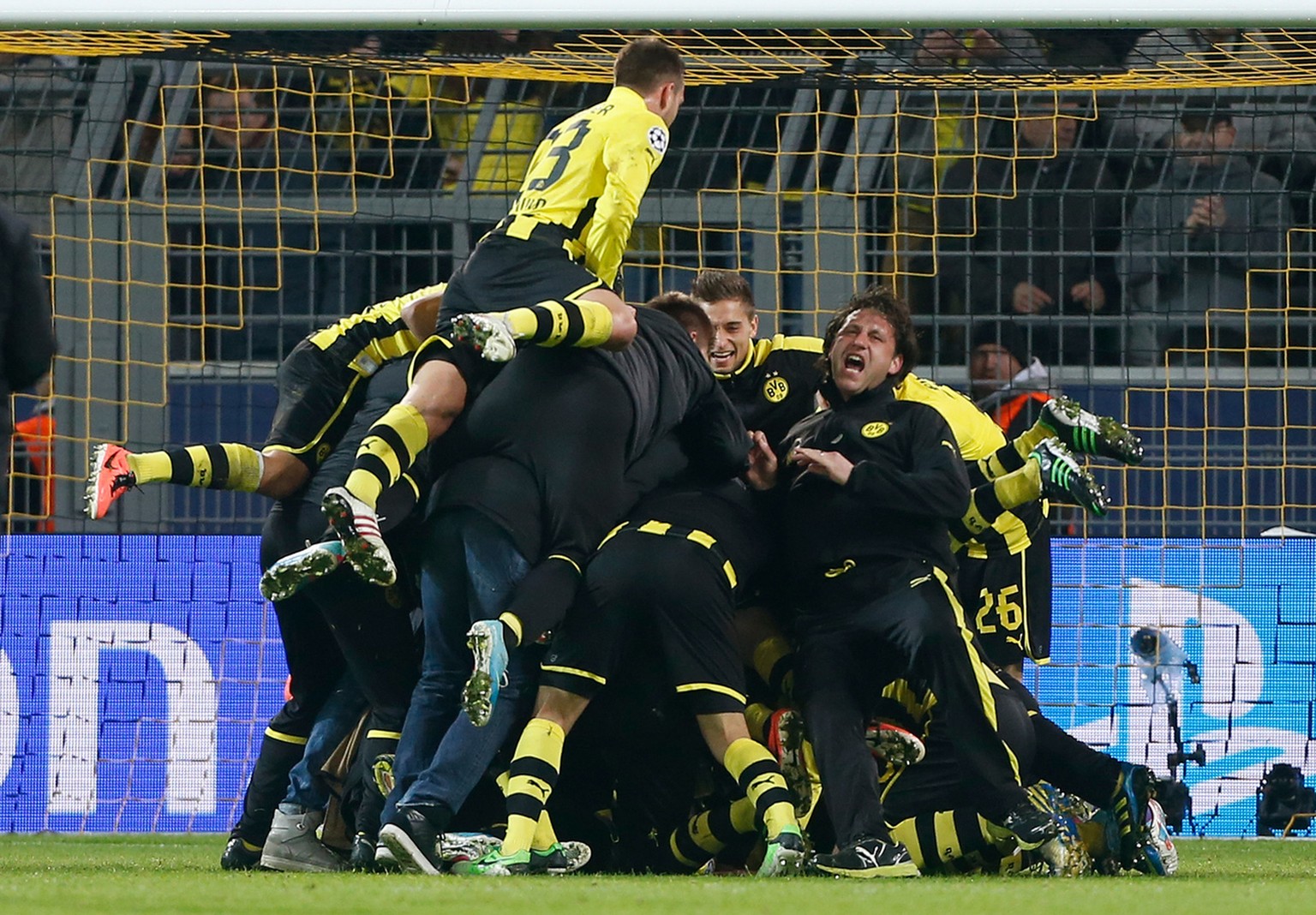 Dortmund players celebrate at the end of the Champions League quarterfinal second leg soccer match between Borussia Dortmund and Malaga CF in Dortmund, Germany, Tuesday, April 9, 2013. Dortmund defeat ...
