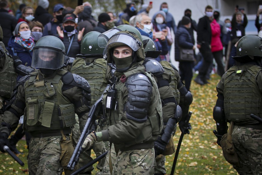 Armed police block demonstrators during an opposition rally to protest the official presidential election results in Minsk, Belarus, Sunday, Nov. 1, 2020. Some thousands of protesters swarmed the stre ...