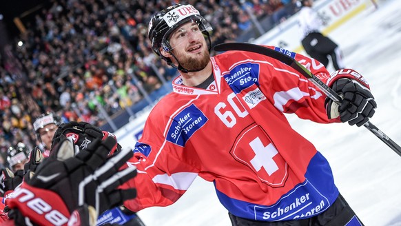 Team Suisse player Tristan Scherwey celebrates after scoring during the game between Team Suisse and Haemeenlinna PK at the 91th Spengler Cup ice hockey tournament in Davos, Switzerland, Thursday, Dec ...