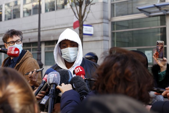 Music producer identified only by his first name, Michel, answers to media, before going to the Inspectorate General of the National Police, known by its French acronym IGPN, in Paris, Thursday, Nov.  ...