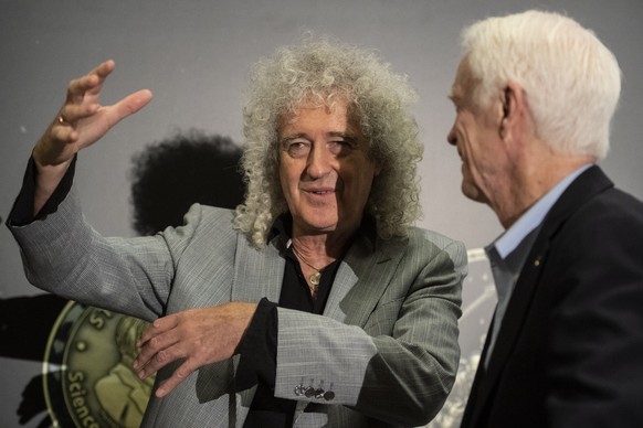 epa07670172 Musician and astrophysicist Brian May (L) speaks with US astronaut of Apollo 9, Russell Schweickart during a panel discussion with Apollo astronauts during a press conference of the Starmu ...
