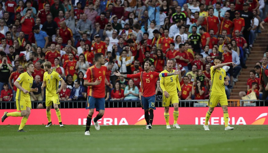 Spain&#039;s Sergio Ramos, center, gestures during the Euro 2020 Group F qualifying soccer match between Spain and Sweden at the Santiago Bernabeu stadium in Madrid, Monday June 10, 2019. (AP Photo/Ma ...