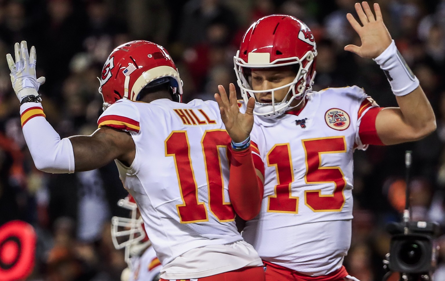 epa08087543 Kansas City Chiefs quarterback Patrick Mahomes (R) celebrates with Kansas City Chiefs wide receiver Tyreek Hill (L) after scoring a touchdown during the NFL American Football game between  ...