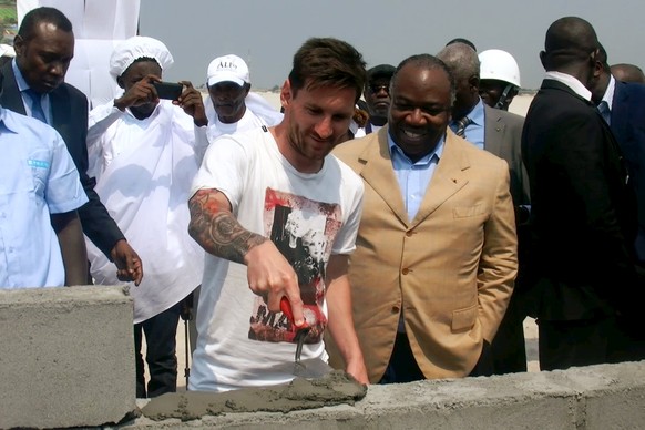 Soccer star Lionel Messi lays the first stone at the construction site of a new soccer stadium in Port-Gentil, Gabon, July 18, 2015. REUTERS/Gérauds Wilfried Obangome